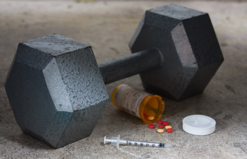 Dumbbell with Performance Enhancing Drugs PEDs